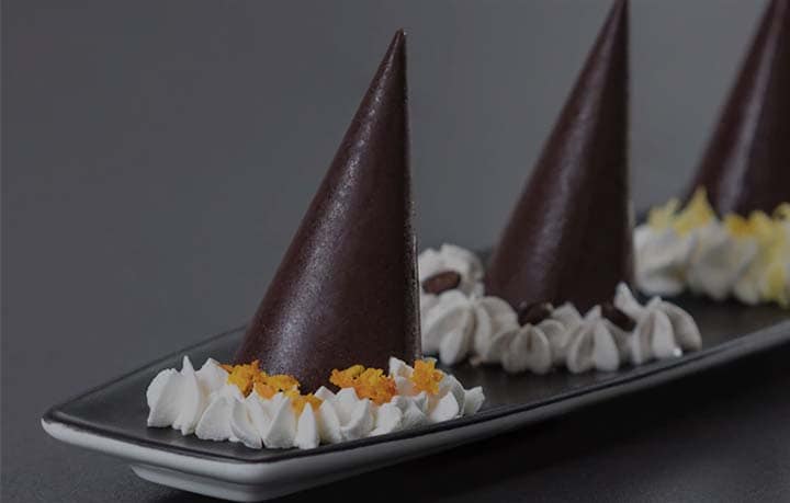Preparing coffee chocolate cones with lavazza